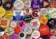 a dense colourful picture of many badges bearing varied gay rights slogans
