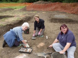 HLF archaeology trainee Hannah with volunteers at the Woking Palace dig