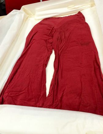A photograph of a red silk pyjama suit produced as evidence in R v Salmon, Austen and 33 others. Reference: EXT 11/131.
