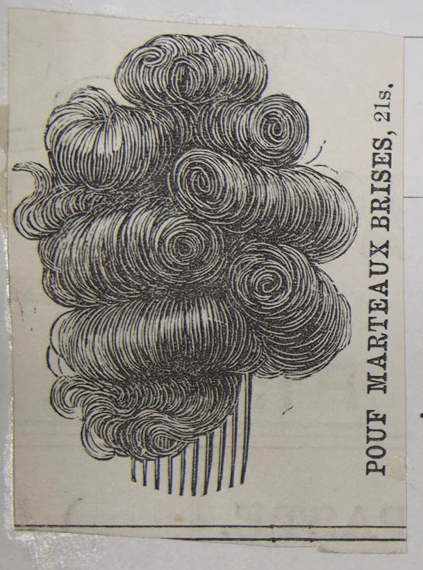 Photograph of artificial hair on comb called 'Pouf Marteaux Brises (1890). Catalogue reference: COPY 1/401/19