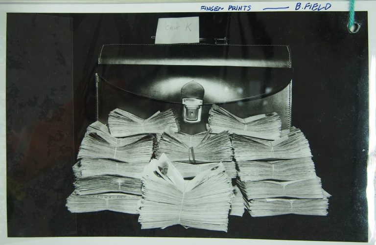 A suitcase and a large amount of money. Evidence collated by Buckinghamshire Constabulary, connected with various robbery cases in 1963 including evidence regarding 'The Great Mail Train Robbery'. Exhibit 11, catalogue reference: J82/423.