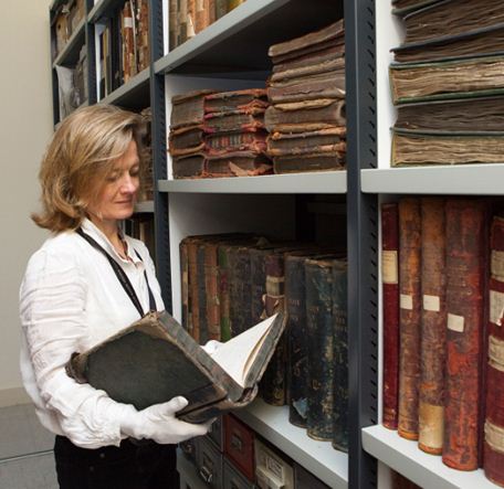 Image showing member of National Gallery staff inspecting ledgers