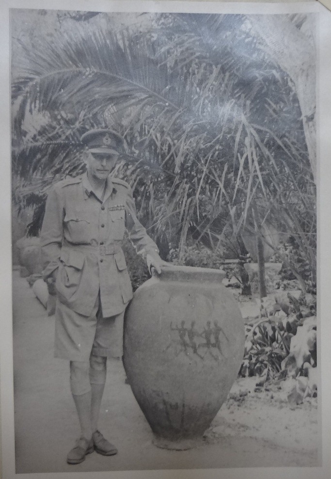 Major General Collier with an artefact, 1943 (catalogue reference: FO 141/963)