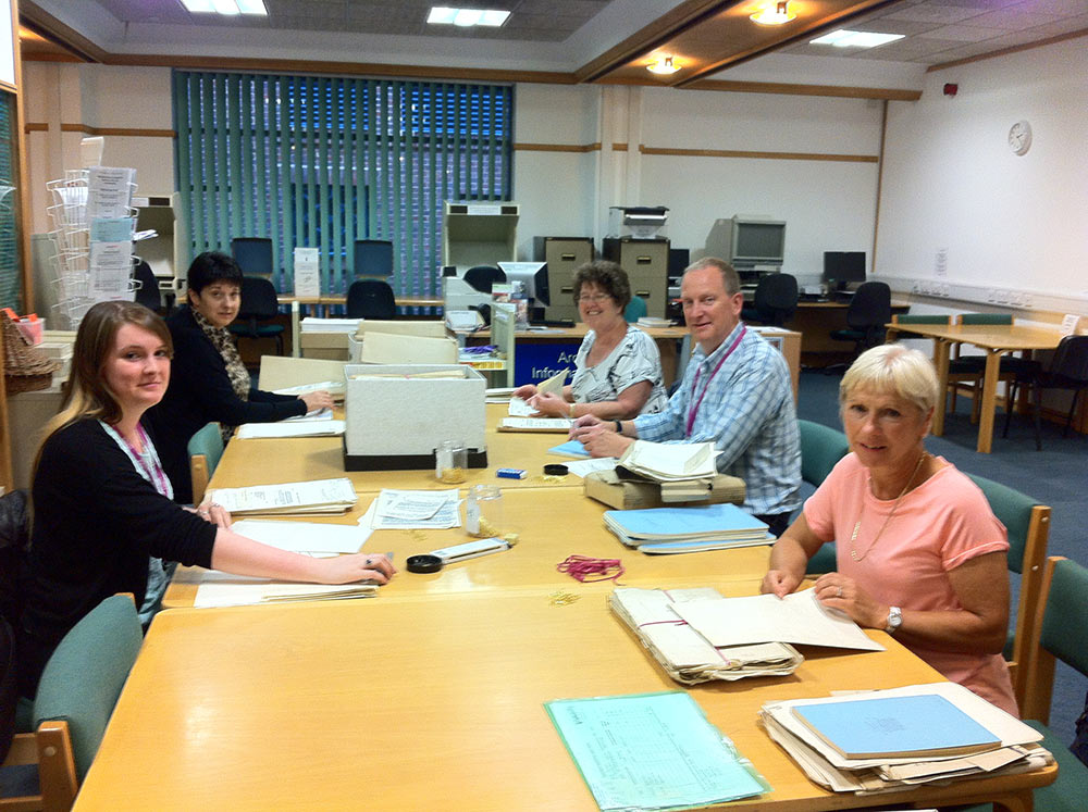 Volunteers hard at work on the cataloguing project. 