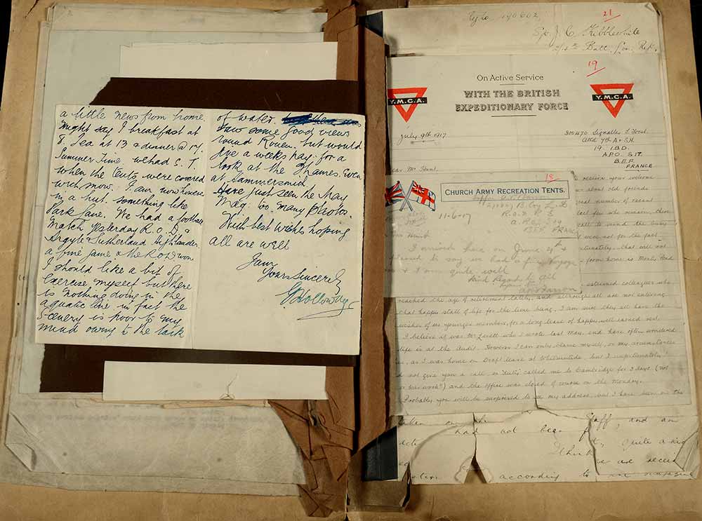 An image of a folder of letter and postcards