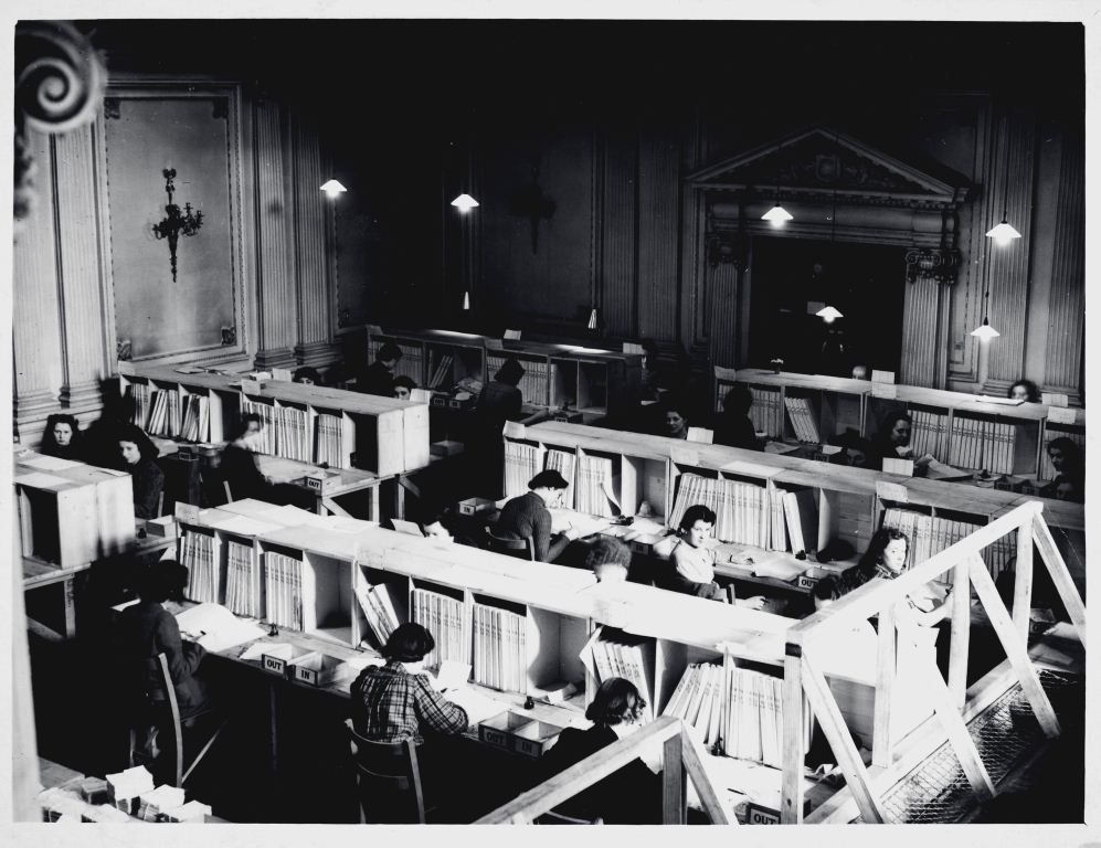 Image of staff working on register for manpower at the Central National Registration Office 1940