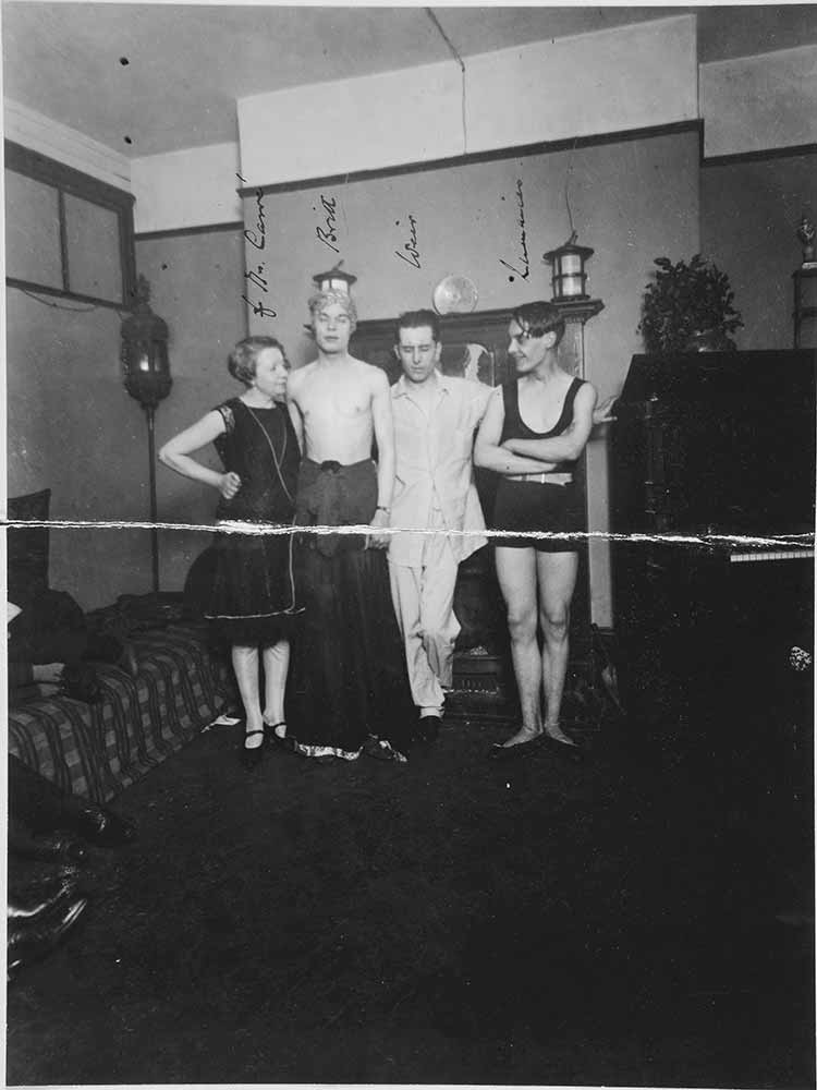 Image of four people stood in a line 