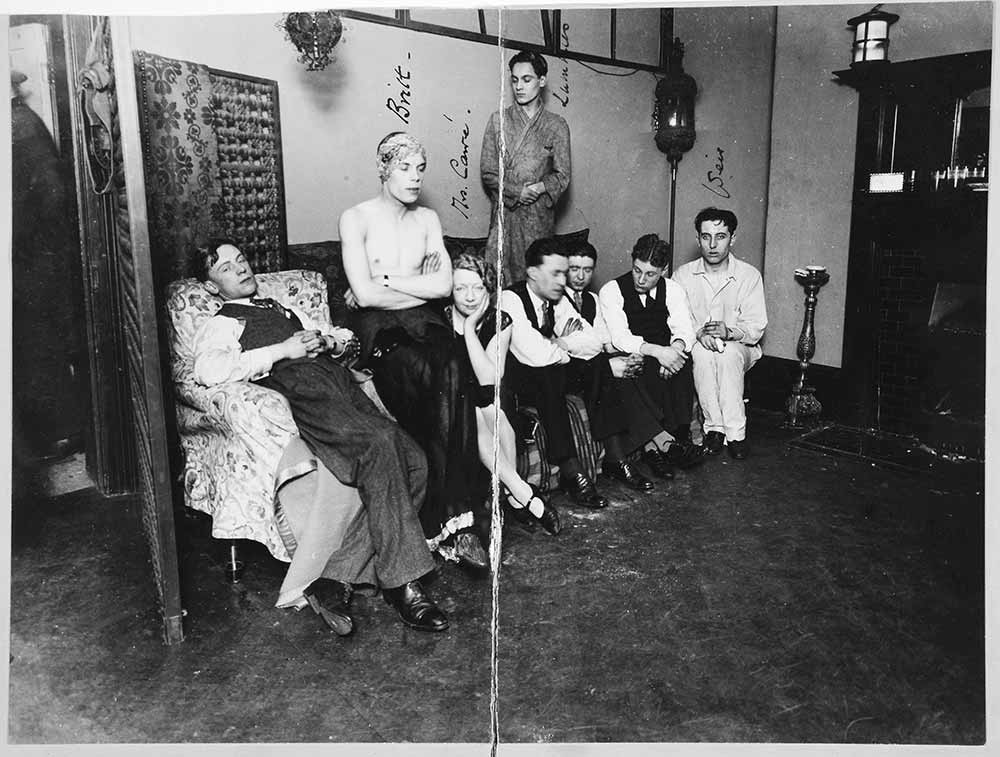 Image of eight people sat in a line
