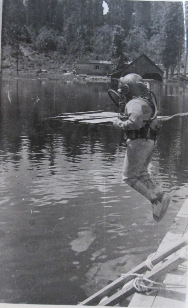 Image of a person in a diving suit jumping into Lake Toplitzee