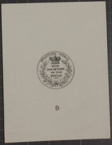 Pen and ink design drawing for medal, around the top third of the medal's circumference is inscribed "MILITARY MEDAL", below that, it bears a laurel wreath and crown surrounding the words "FOR BRAVERY IN THE FIELD"