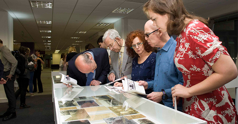 Image of five people looking into the display cases