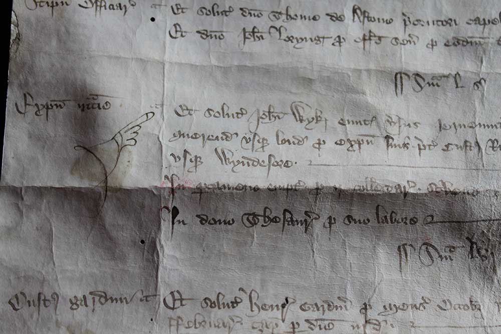 Image of a manuscript featuring a manicule (pointed finger)