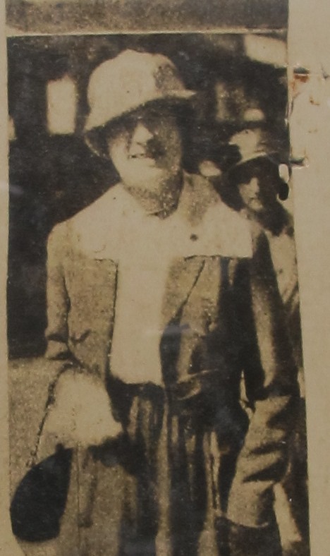 Image of a photograph of Madame Hella Vuolijoki, who is wearing a hat and glasses