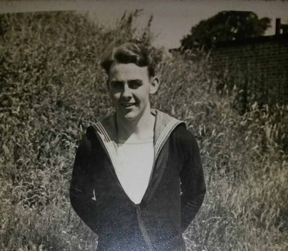 Black and white photograph of seaman Denis Mahoney in his uniform