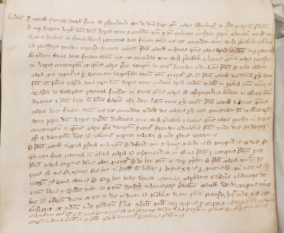 Chaucer acting as surety for the appearance of Matilda Nemeg accused of leaving her service to Maria Alconbury without licence (Chaucer's name can be seen in the bottom right of the document, six lines from the bottom) [catalogue reference: CP 40/511 rot. 531]