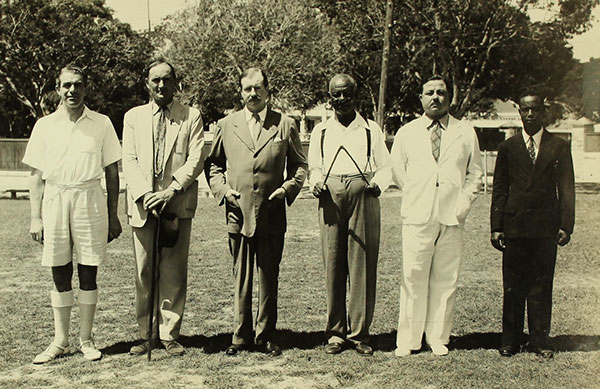 Baldwin with Claude Bell holding a water diviner rod