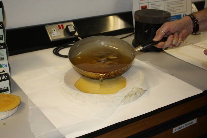 A member of Collection Care staff making a wax seal cast