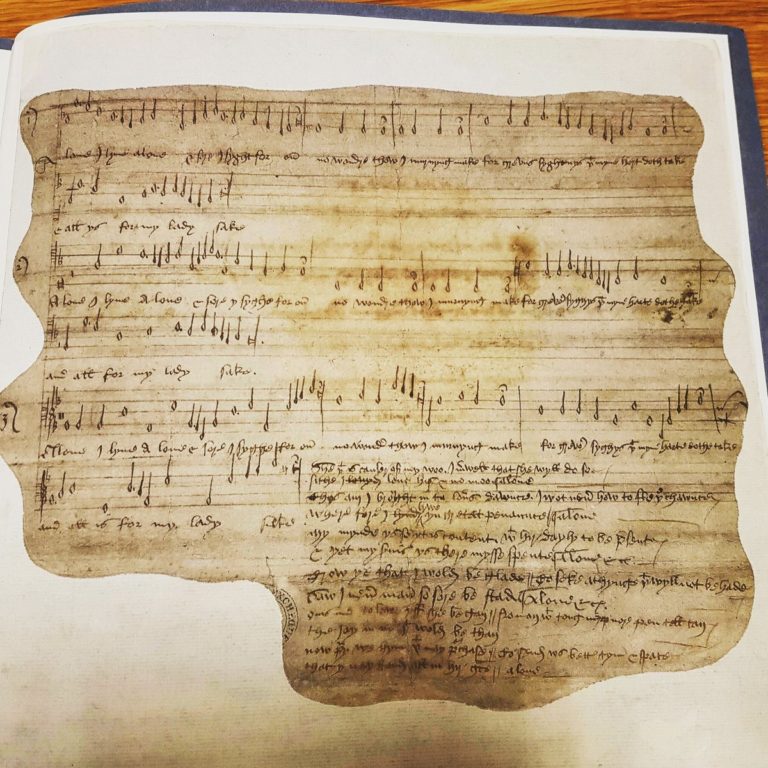 E 163/22/1/1 Doodled medieval love song written on the back of a report on a riot.