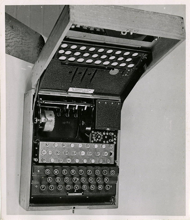 Black Enigma Machine in the 1940s. Catalogue ref: HW 25/26.and white photograph of the