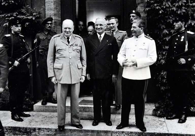 Photograph taken of attendees of the Potsdam Conference: Churchill, Truman and Stalin at Potsdam, 26 July 1945.