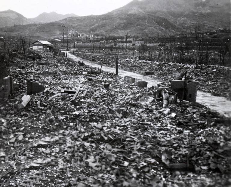 Black and white photograph showing the devastation caused by the atomic bomb blast at Nagasaki – HMS Speaker's evacuation of POWs from Nagasaki, September-October 1945.