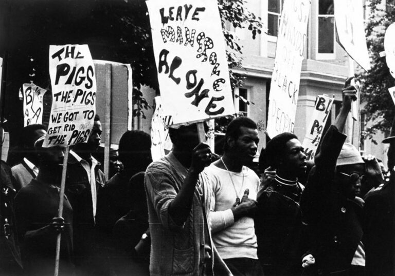 Photograph of a crowd of protesters including Lennox France, taken on 9 August 1970.