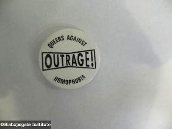 A pin badge from ‘Outrage! Queers Against Homophobia’ from 1990.