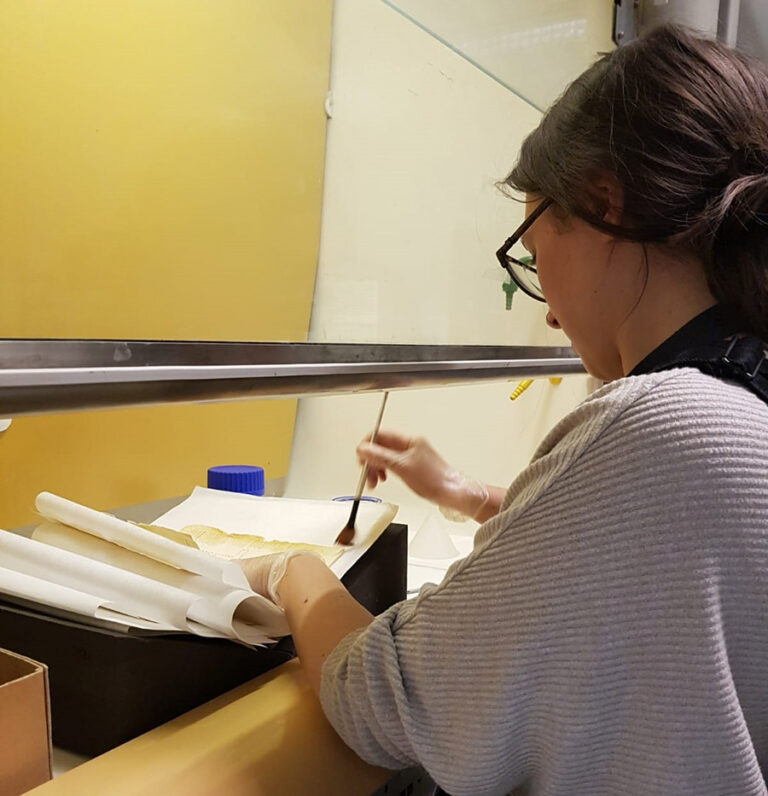 Harriet shown at work lining documents with 2% klucel-g in propan-2-ol in a fume cupboard.