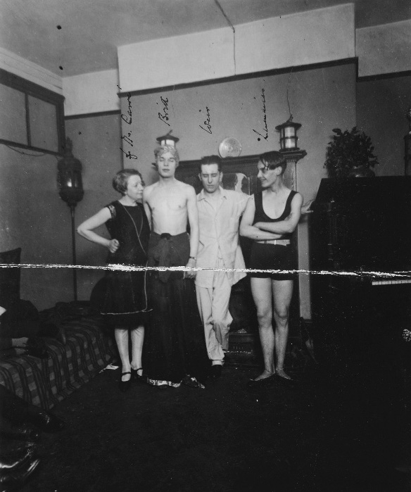 Black and white photograph of four individuals present during a raid of Fitzroy Square, used as evidence in 1927.