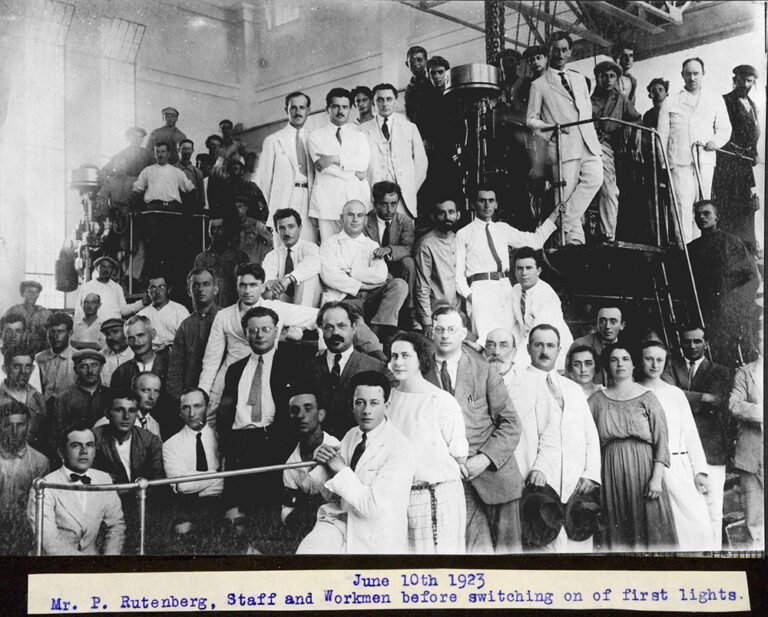 A posed photograph of approximately 50 people including Rutenberg, staff and workmen before switching on of first lights, Jaffa Electric Works, Palestine, 1923.