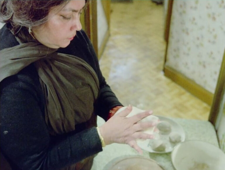 Still from 'Insaaf': Mrs Choudhry making chapatis.