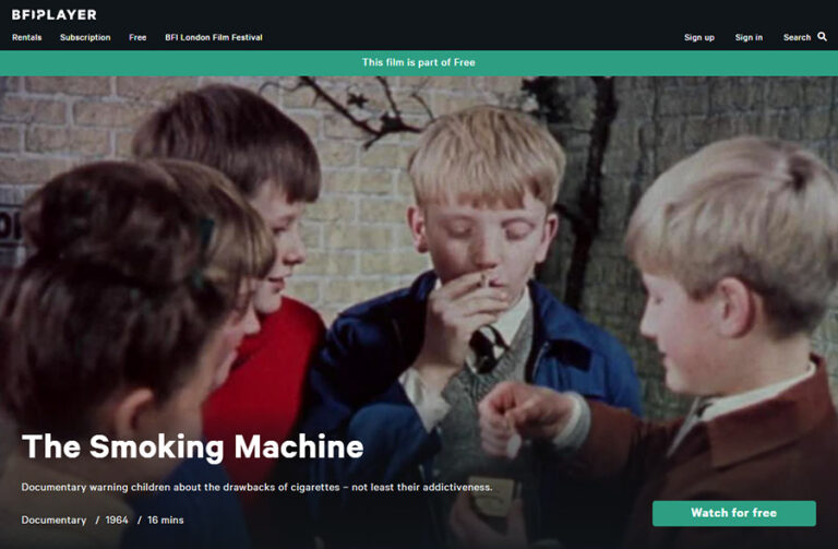 Screenshot of 'The Smoking Machine'. We see a groupt of five young schoolboys smoking cigarettes.