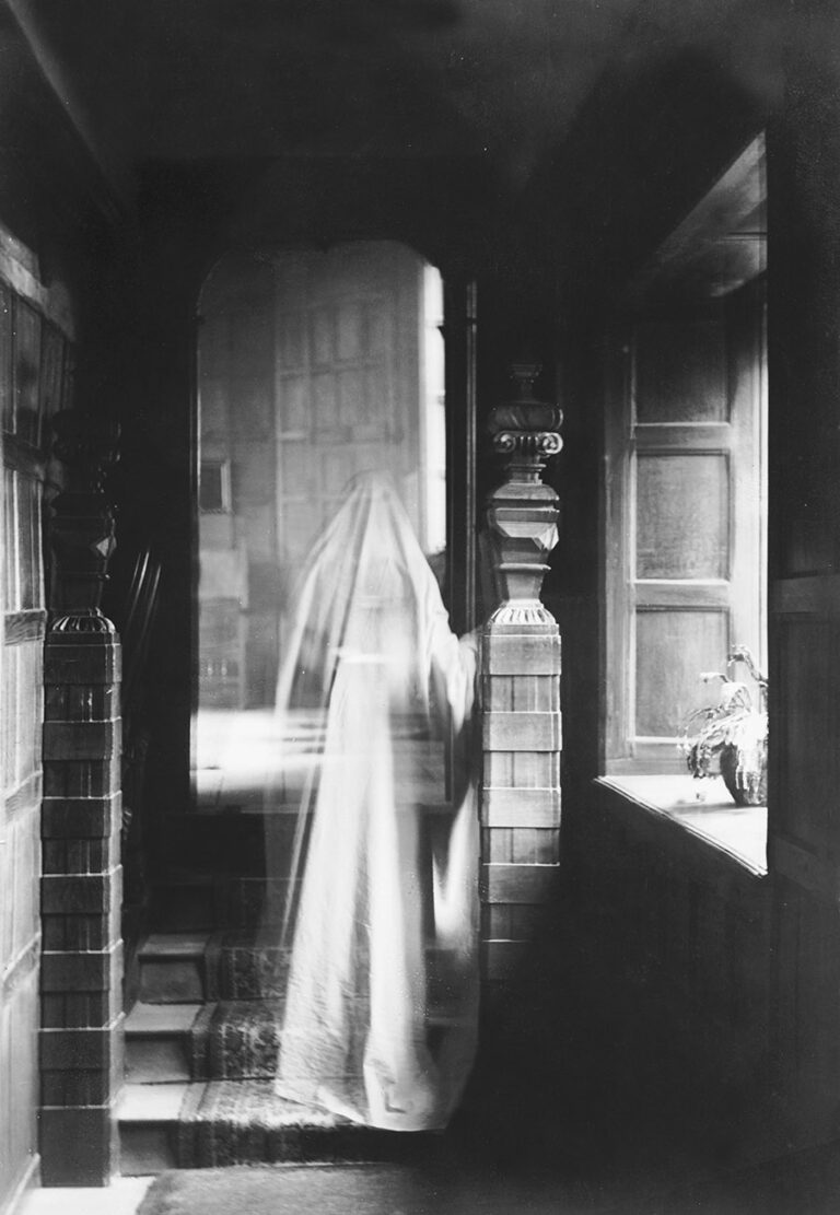 A ghostly figure on a staircase in 1899.