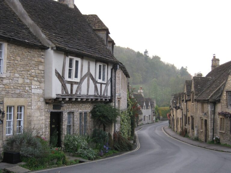 Street view showing traditional cottages in a Cotswolds village.