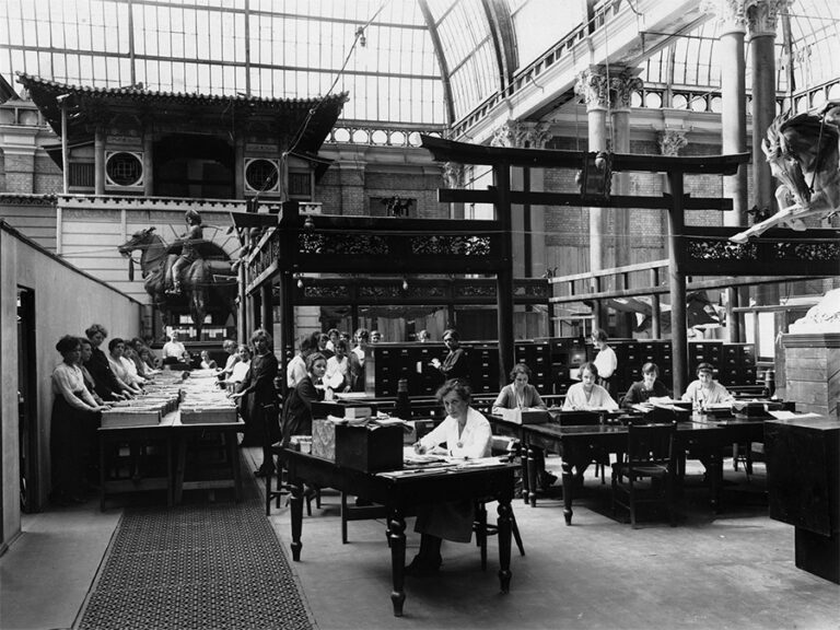 Government employees working at desks in a makeshift office in Alexandra Palace in the 1920s.