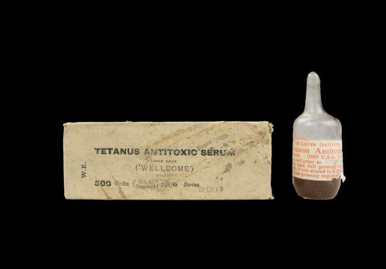 Against a black background, an image of a medical card for Tetanus Antitoxic serum and a bottle of the serum.