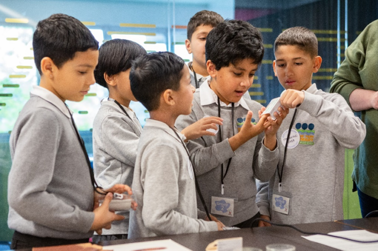 Six young school children take part in a learning session.