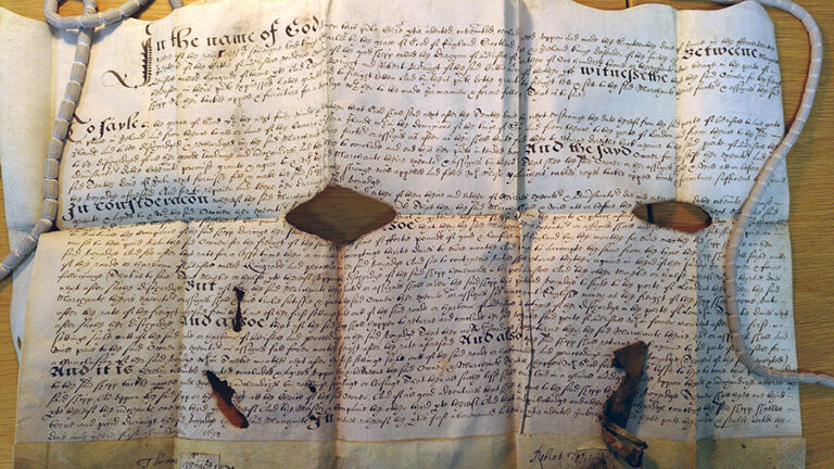 A large archival document featuring handwritten text.