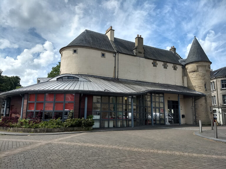 An old building with a modern extension.