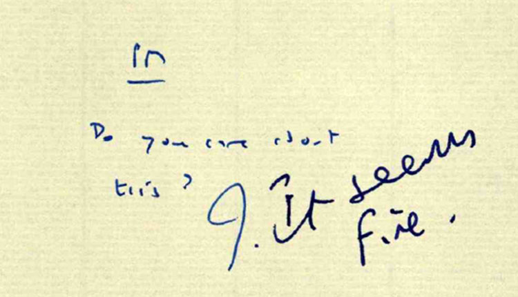 Close-up of a note handwritten in pen.