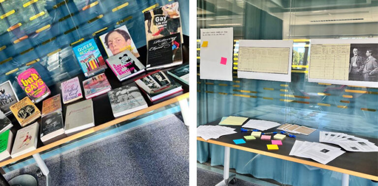 A table covered in books, and a table covered in papers and sticky notes.