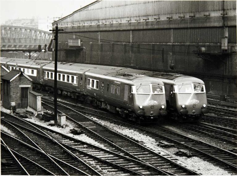 Photograph of two trains beside each other.
