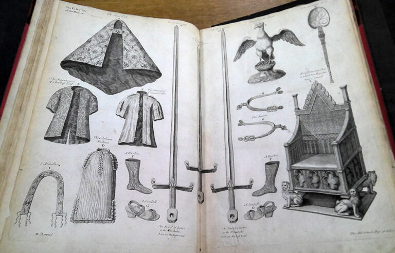 Double page spread of illustrations of various objects to be used in the coronation, including swords, robes and a throne. 