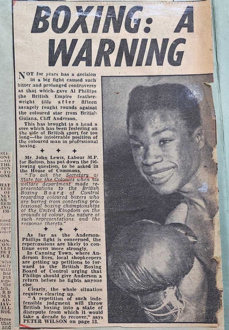 Newspaper article with the headline 'Boxing: A warning' and a photo of a smiling Black boxer.