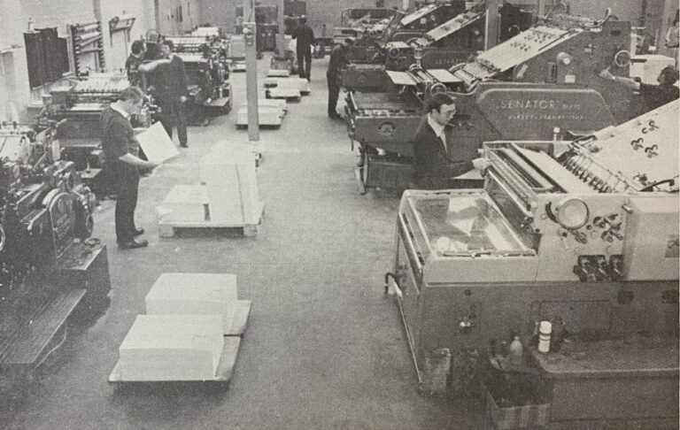 Workers in a warehouse, which was the printing presses at HM Stationery Office's Manor Farm Press. 
