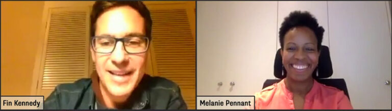 Screenshot of a smiling man wearing glasses and a smiling woman with short, frizzy hair on a video call.