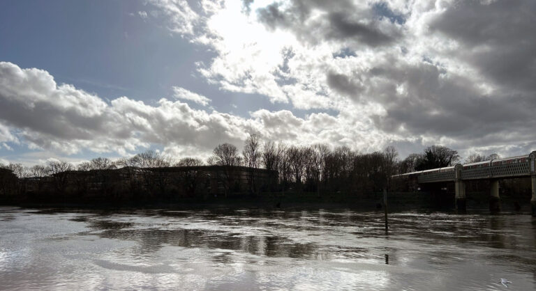 The National Archives on a cloudy day from across the River Thames at Stran-on-the-Green.