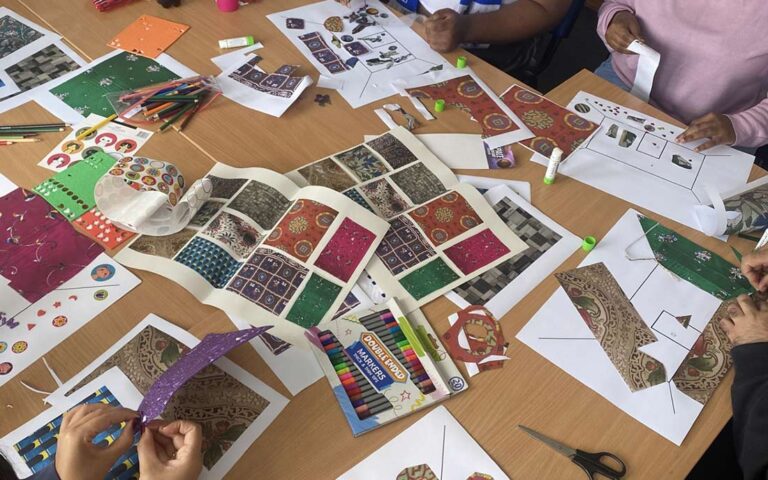 Photograph of creative room decorating activity involving participants from Share community.