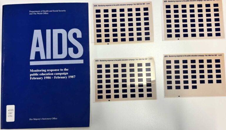 A blue booklet with the large title 'AIDS' next to four microfiches.