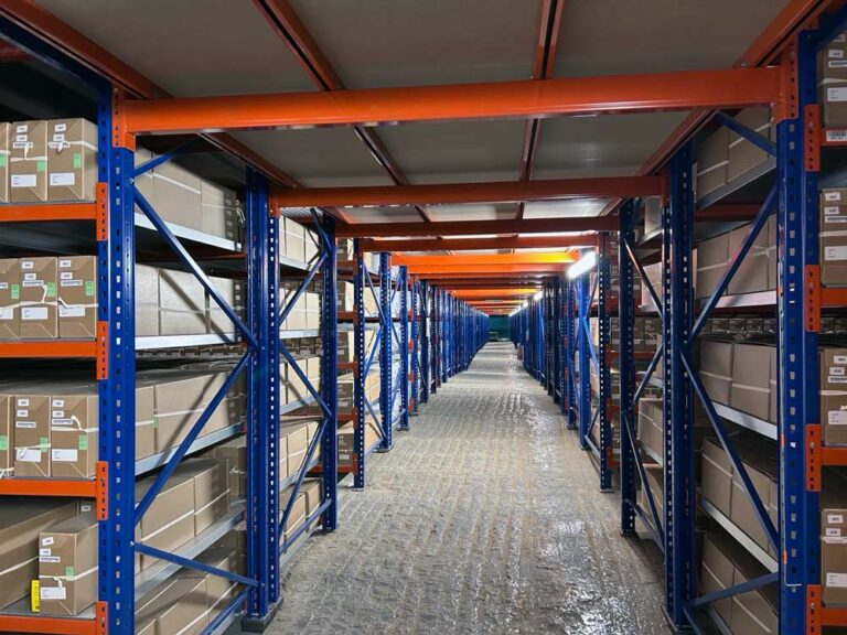 Inside a document storage facility where there are racks containing documents.